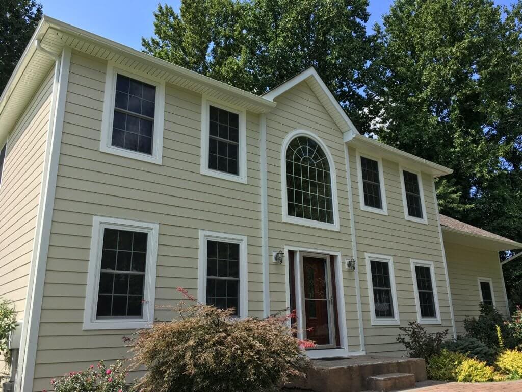 front of house with new windows and siding