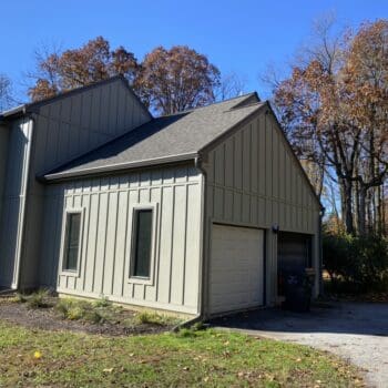 Side view of a home garage after getting new siding