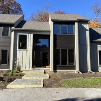 Close up after image of the front of a home in Malvern, PA that got James Hardie siding and vertical board installed by MHX Designs