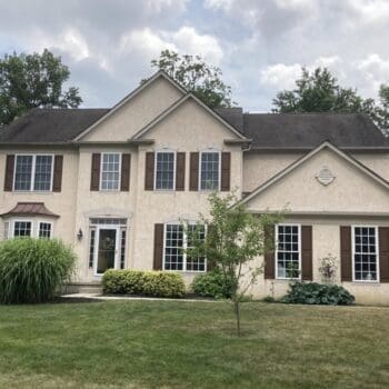House in Maple Glen, PA with old stucco and vinyl siding