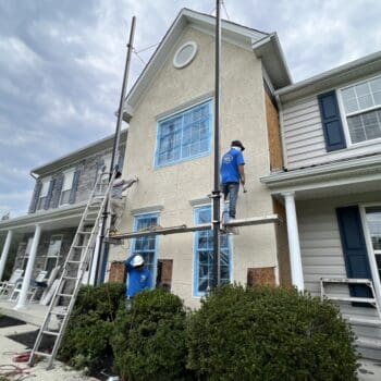 Before a Stucco to CertainTeed board & batten siding installation in Pottstown, PA -1