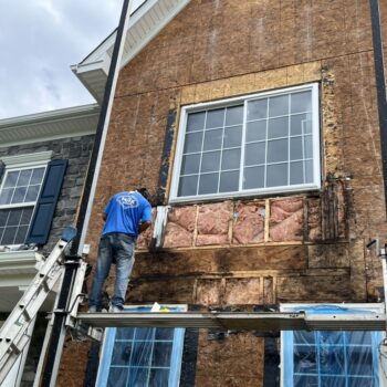 Before a Stucco to CertainTeed board & batten siding installation in Pottstown, PA -3
