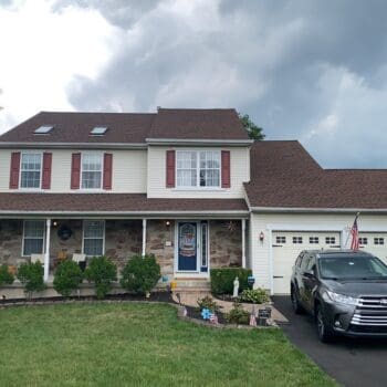 Warrington, PA home before getting a new roof, railings and front door - 1